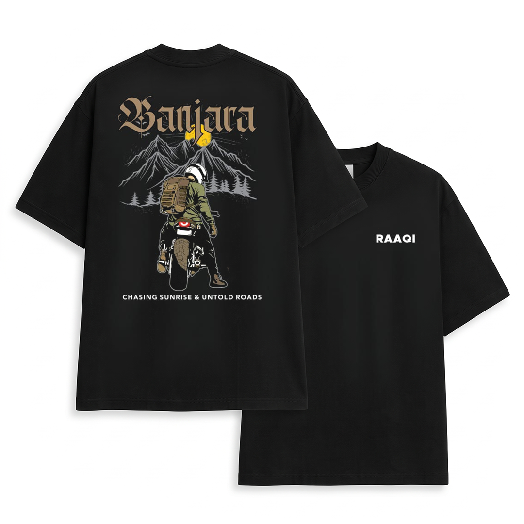 Two black short-sleeve graphic T-shirts shown on a white background, with the back view of one shirt featuring a large illustrated design and text, and the front view of the other shirt showing the word 'RAAQI' on the chest.