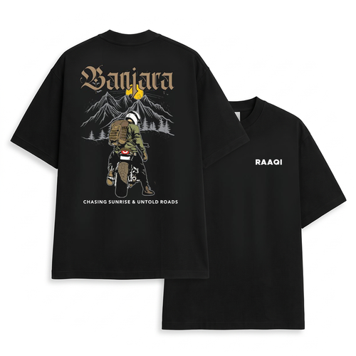Two black short-sleeve graphic T-shirts shown on a white background, with the back view of one shirt featuring a large illustrated design and text, and the front view of the other shirt showing the word 'RAAQI' on the chest.